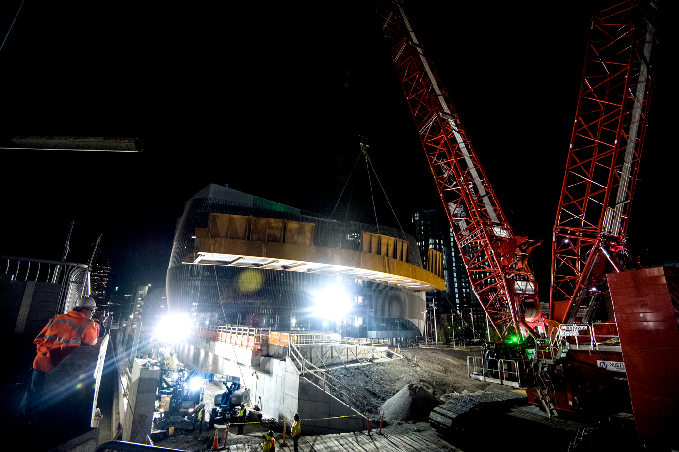 people watch ISEC Pedestrian Bridge installation