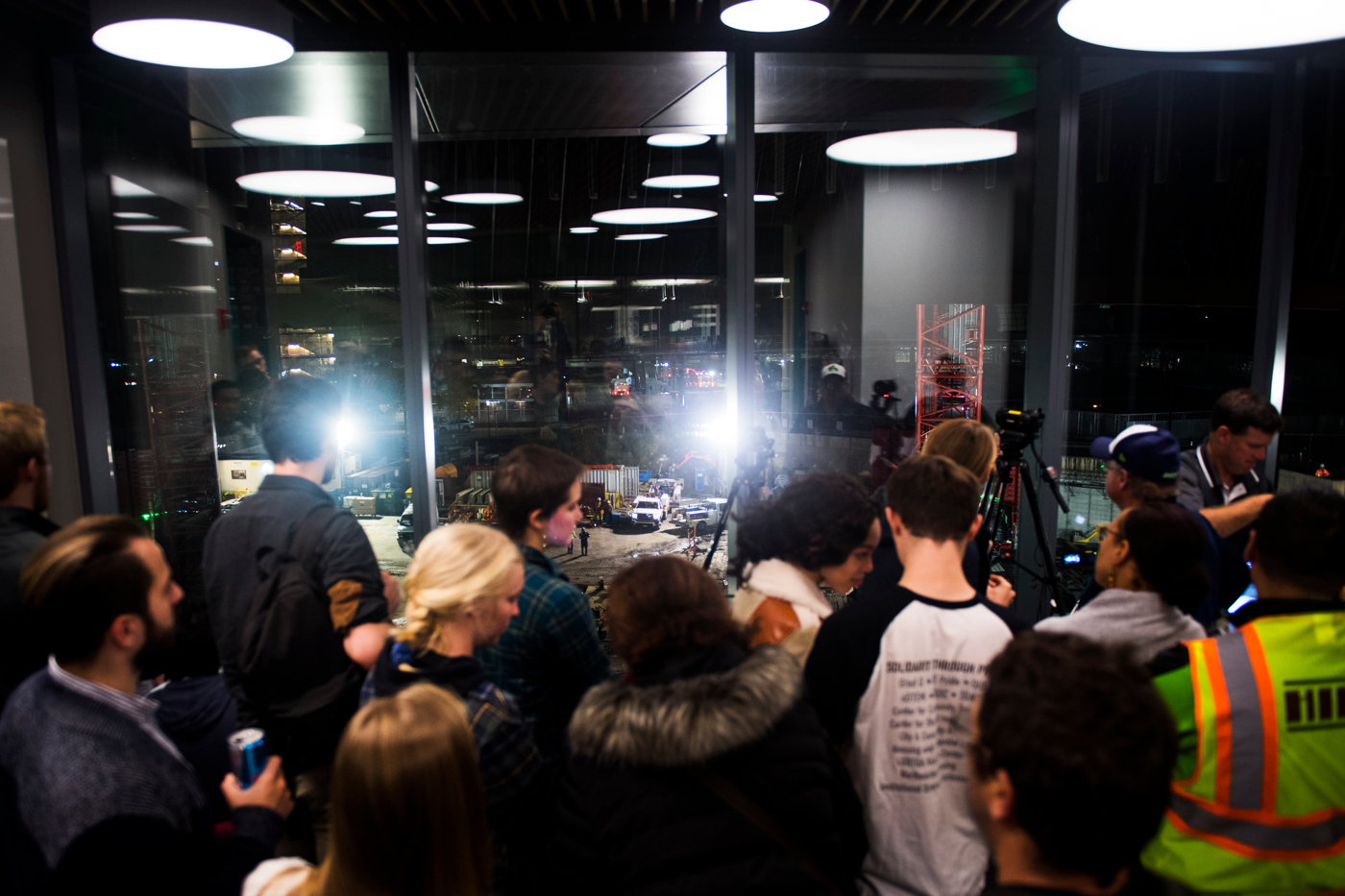 people watch ISEC Pedestrian Bridge installation