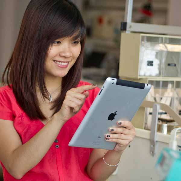 woman touching tablet screen