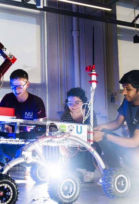 students working on robot