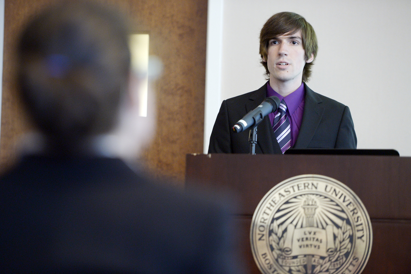 Jordan Harris, E'17, presents on his research co-op through the CaNCURE program at Nanomedicine Day on June 15 in Dodge Hall. Photo by Matthew Modoono/Northeastern University