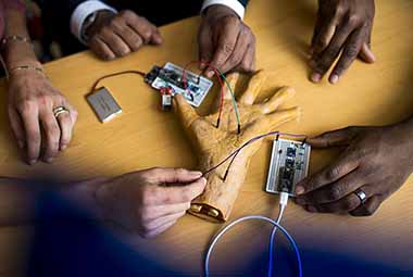 electrical wires in model hand in lab