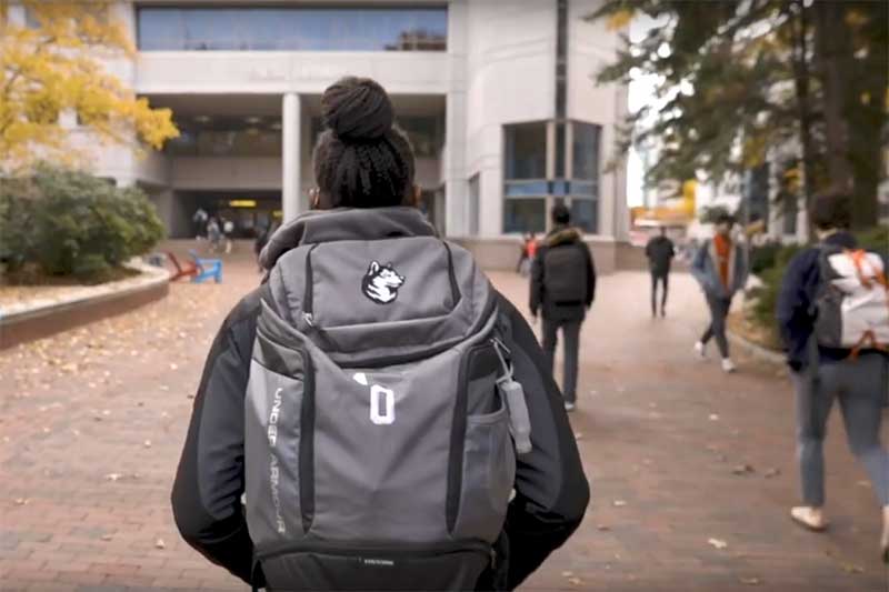 a student walks around the Northeastern campus