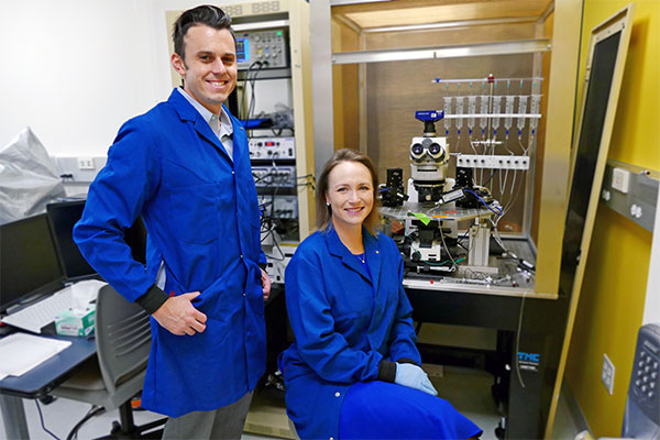 professors posing in chemical engineering lab