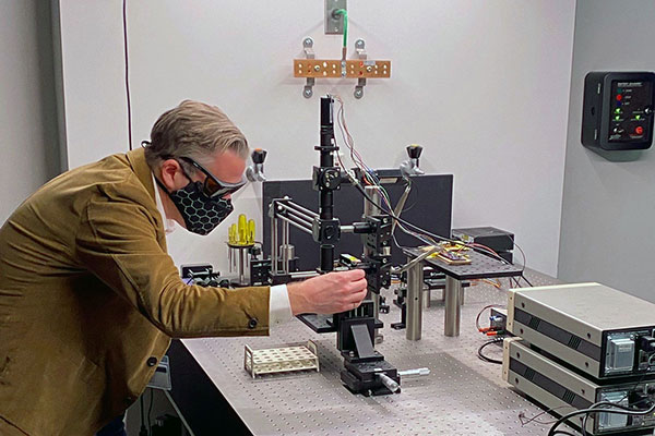 professor working in lab on project