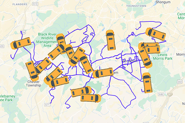 graphic illustration of school buses on a map with purple route marks