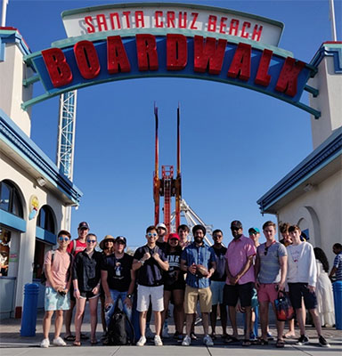 students in front of santa cruz beach boardwalk