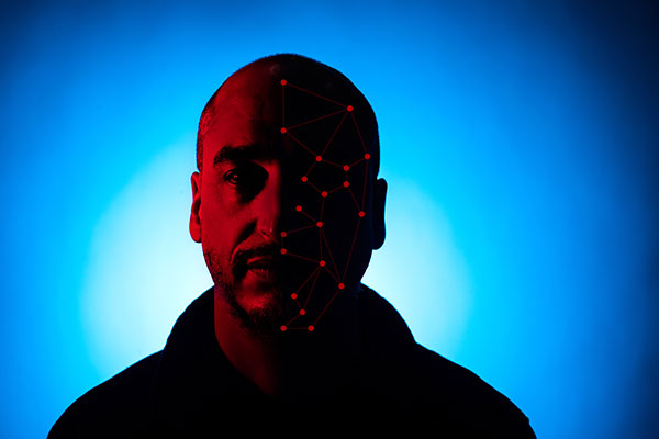 person with half of face digitized to simulate racial bias software