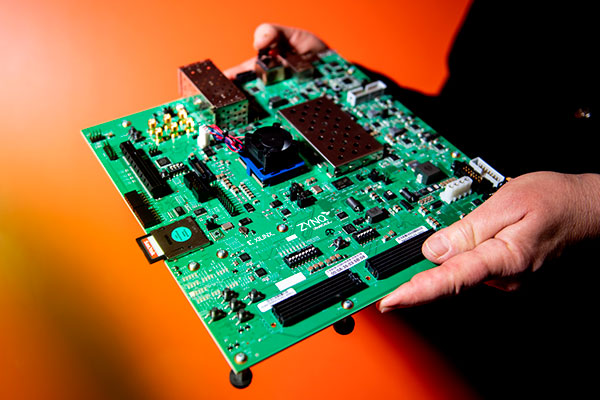 someone holding a circuitboard