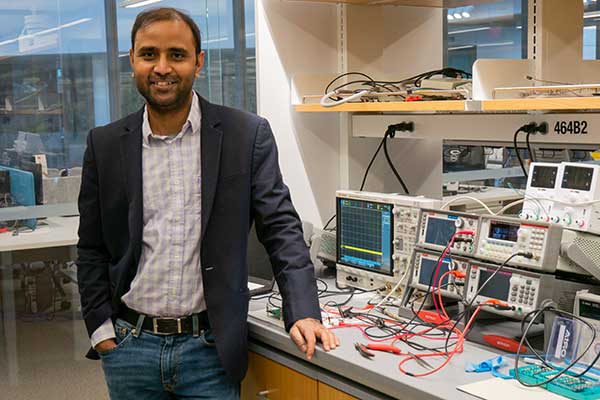 Aatmesh Shrivastava stands in his lab.