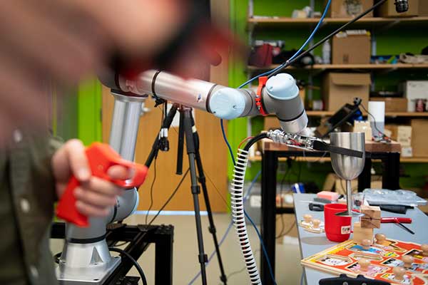Computer engineering graduate student Rui Luo operates the robot that will be entered into the September 2021 semifinals of a $10 million global robotics competition.