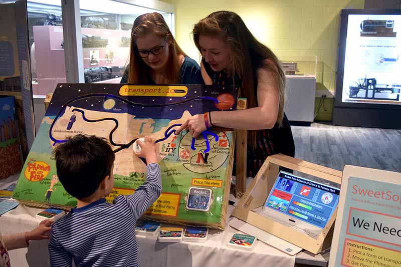 Engineering first year students show a sustainability exhibit at the Museum of Science 