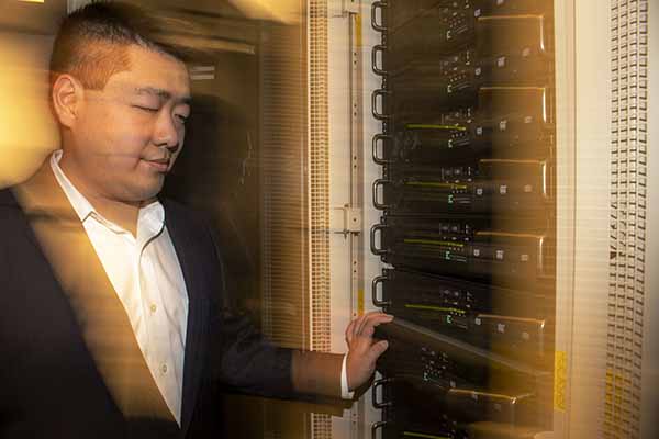 prof next to network rack